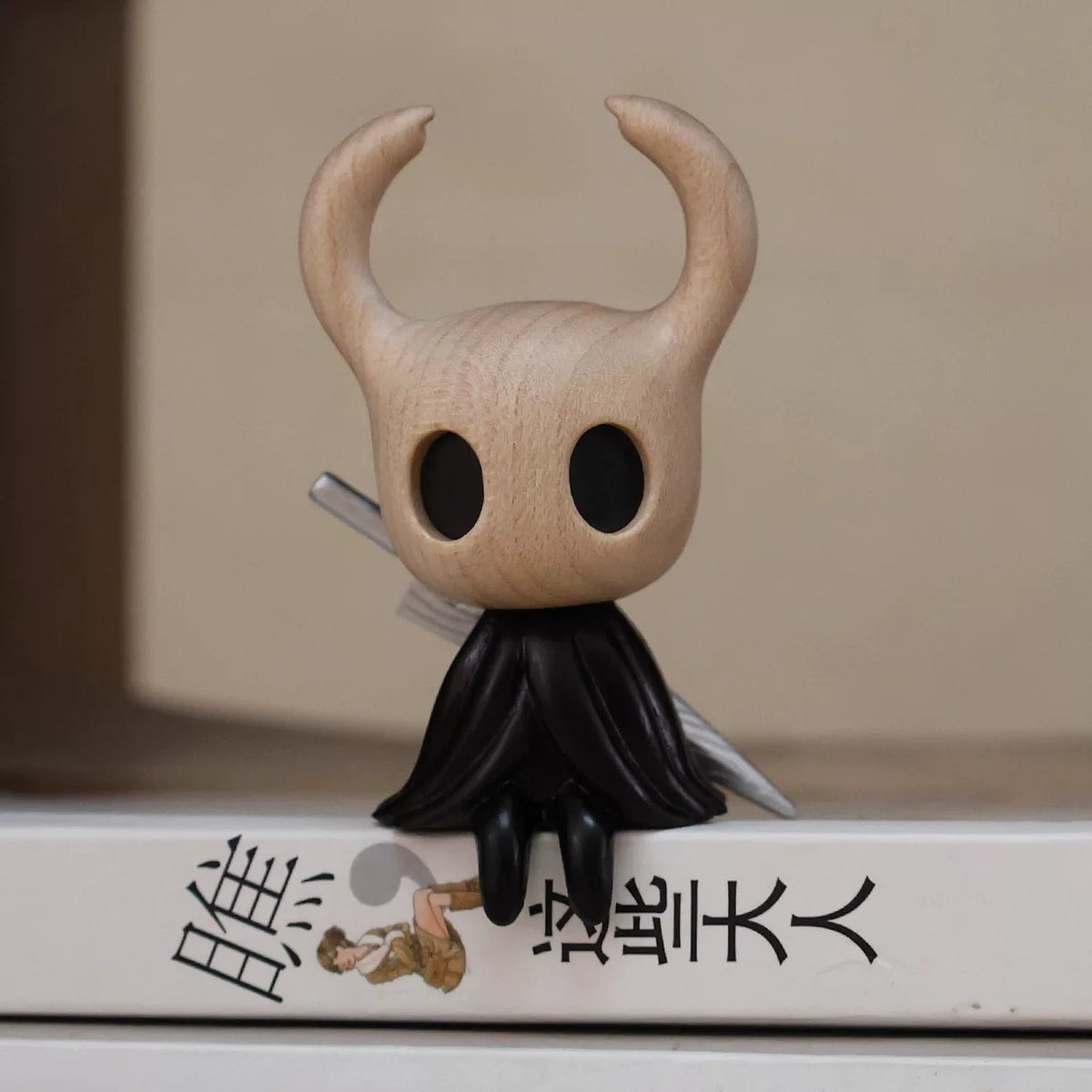 Wooden Knight figure perched on a shelf