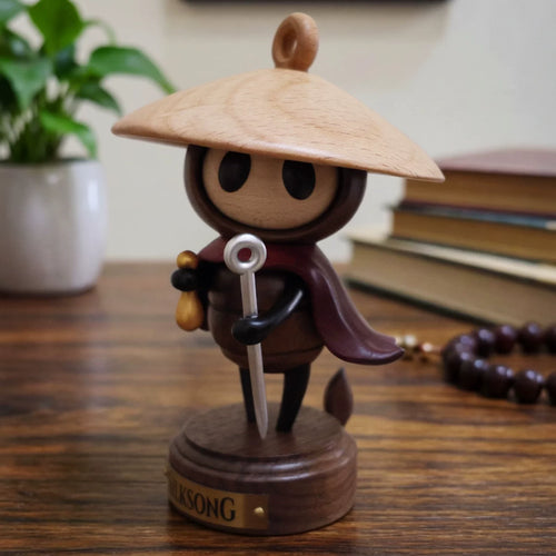 Sherma wooden figure displayed on a desk
