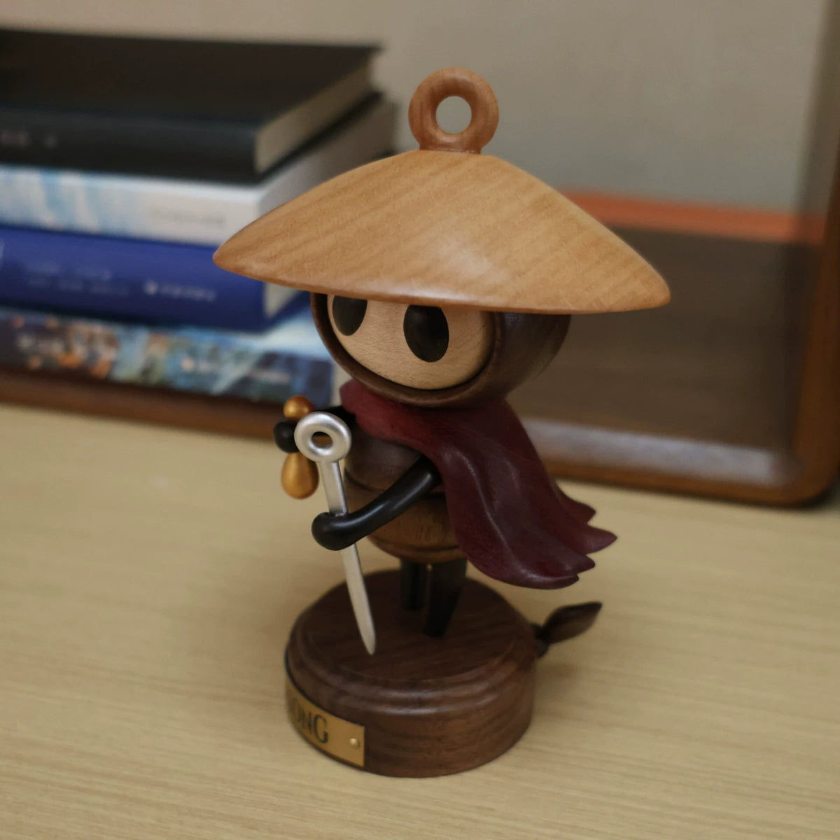 Side view of Sherma wooden figure with straw hat